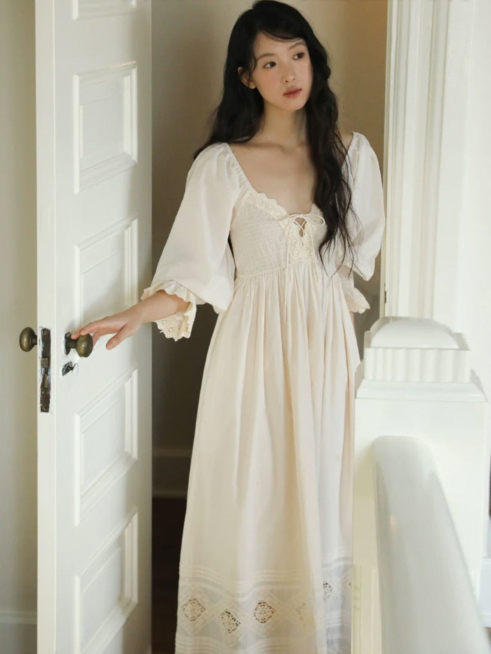 Flowing ivory cotton nightgown with lace trimmed puff sleeves and embroidered eyelet hem