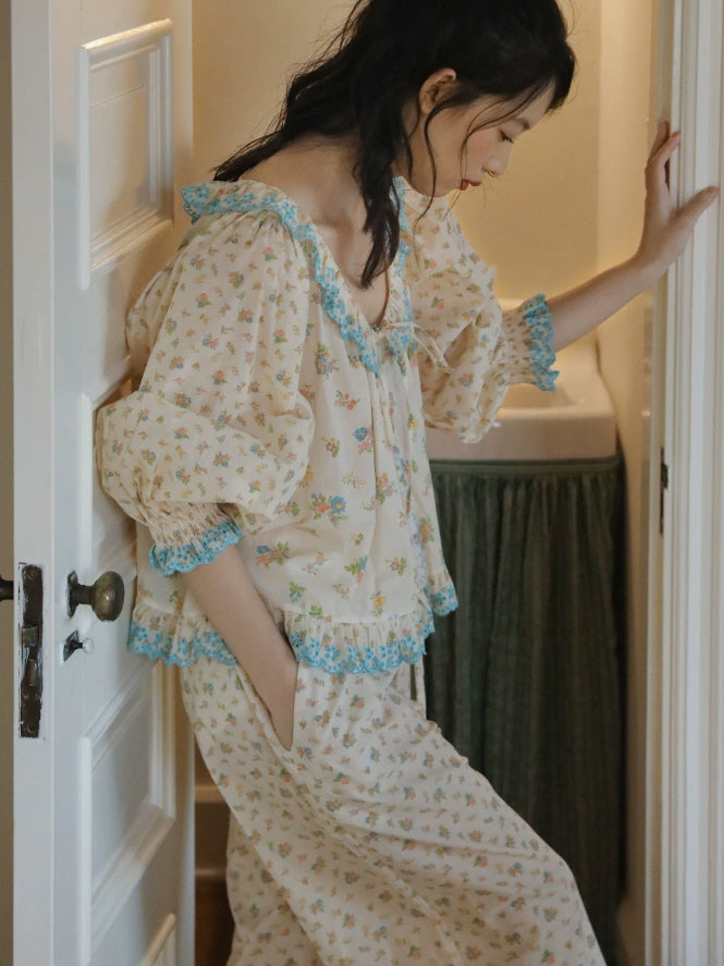 Romantic floral cotton pajama set with blue lace trim, ruffled neckline and relaxed wide leg pants