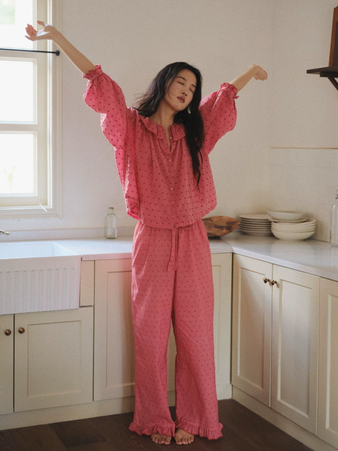 Vintage inspired pink pajama set with button front blouse, ruffled collar and relaxed straight leg pants