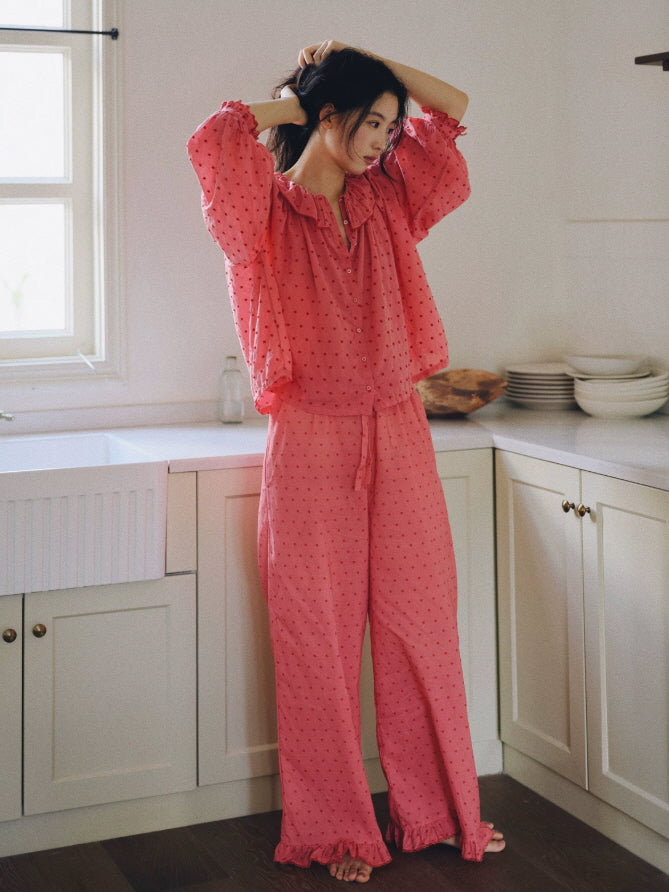 Cottagecore inspired pink cotton pajama top with ruffle neckline, puff sleeves and delicate dotted texture