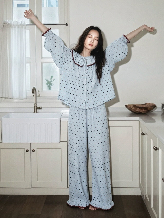 Relaxed light blue polka dot pajama set with gathered sleeves, burgundy ruffle trim and drawstring pants