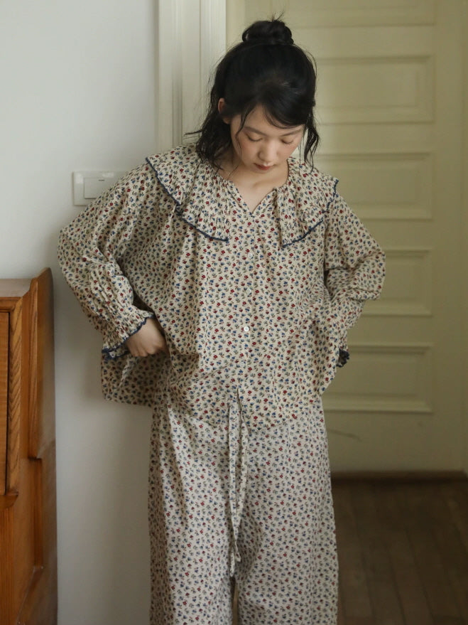 Floral cotton sleepwear set with vintage inspired ruffle collar styled for cozy lounging at home