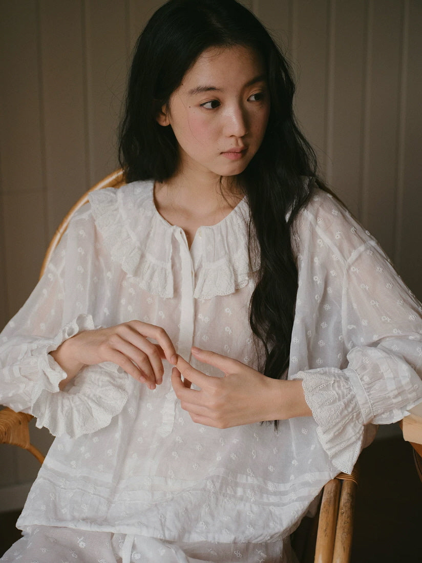 Soft white cottagecore loungewear set with long sleeves, eyelet embroidery and ruffled cuffs