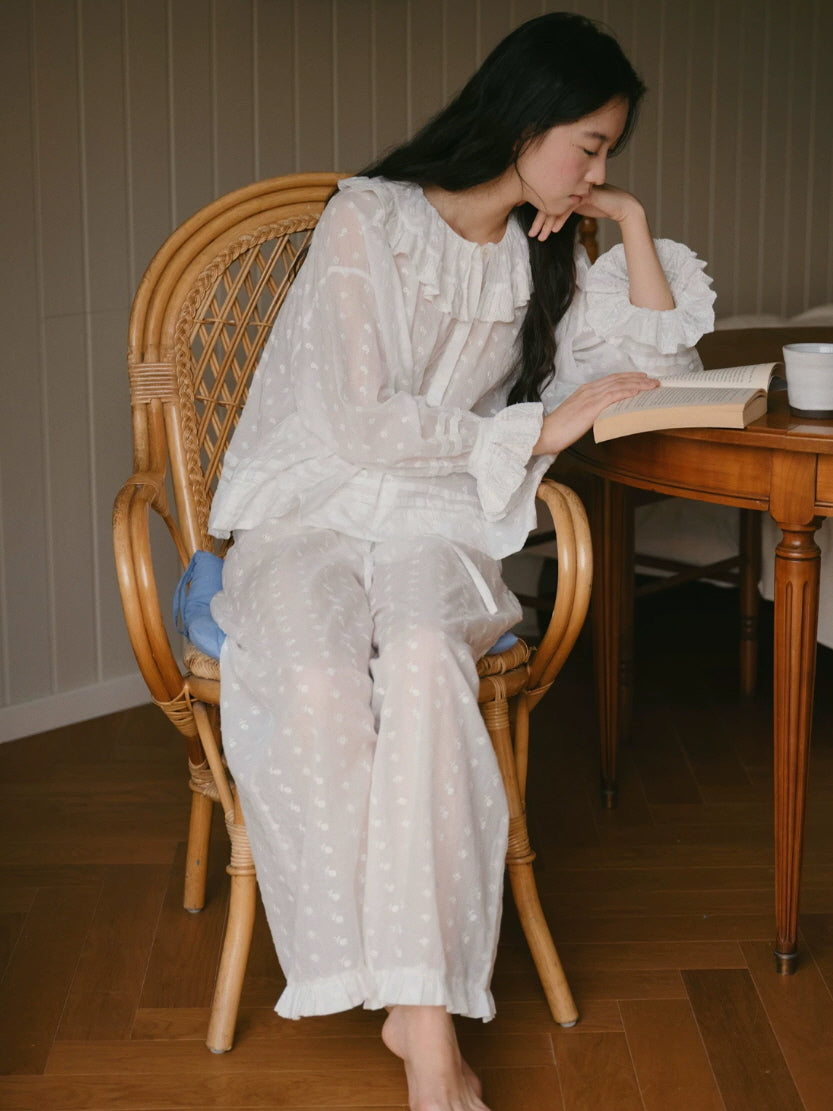 Romantic white loungewear set with embroidered texture, ruffled neckline and relaxed silhouette