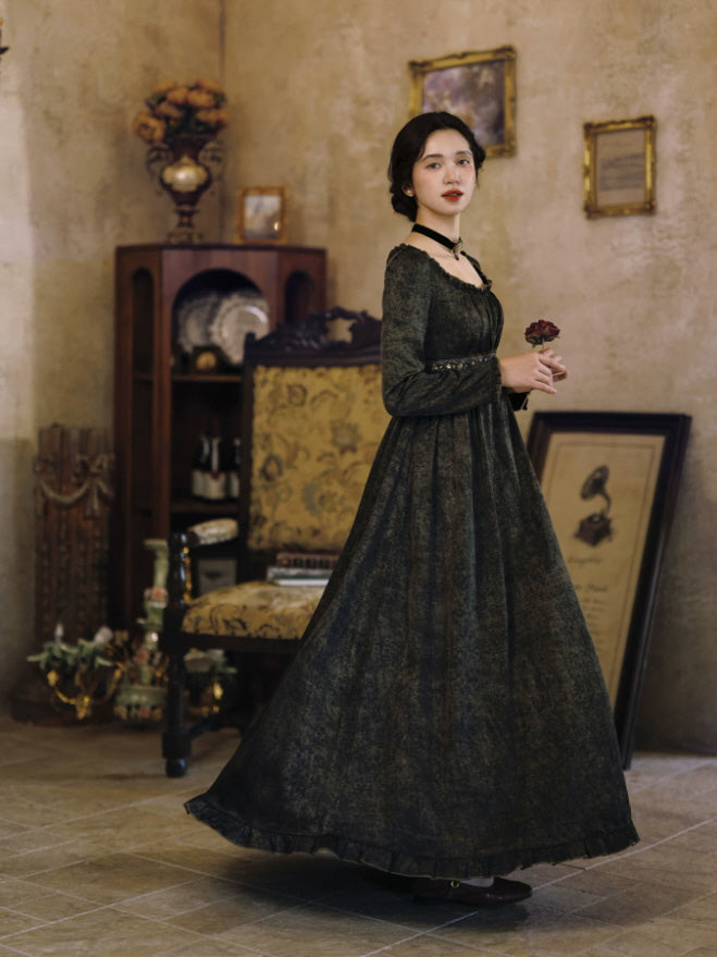 Romantic dark brown maxi dress with long sleeves and flowing vintage silhouette in an antique interior