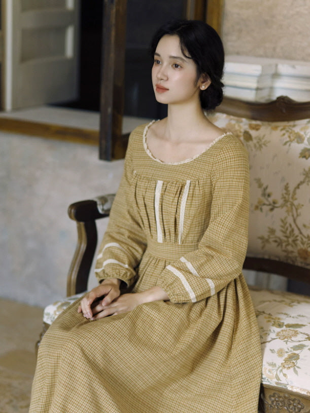 Cottagecore check maxi dress with square neckline, defined waist and flowing skirt in warm mustard tones