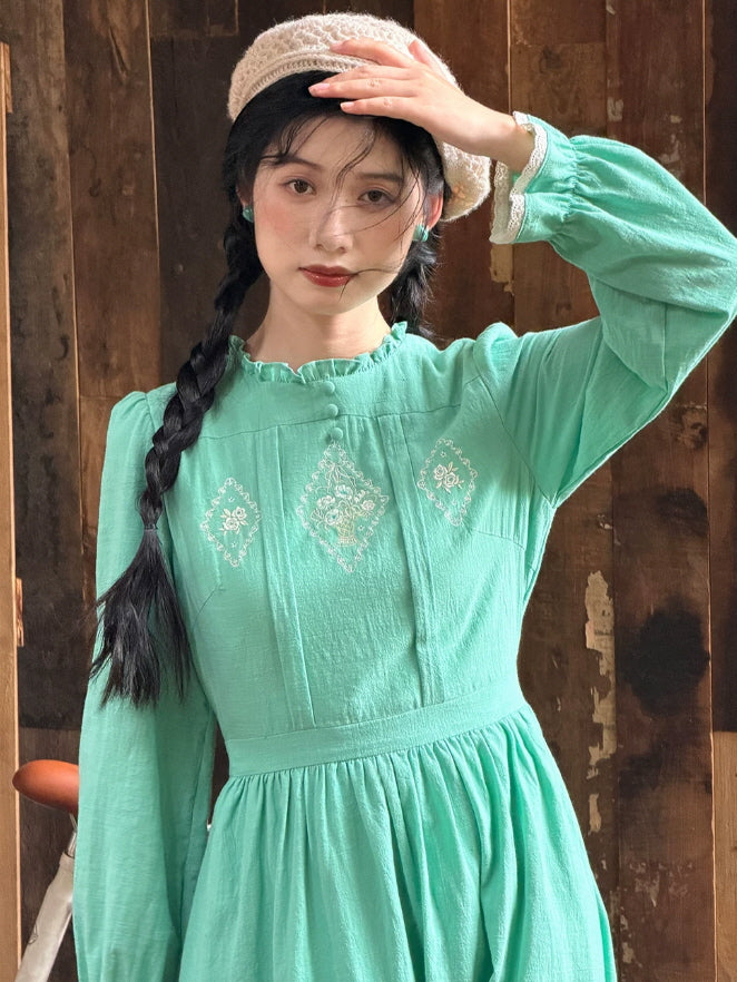 Romantic mint green maxi dress with vintage embroidery, ruffled collar and softly gathered skirt