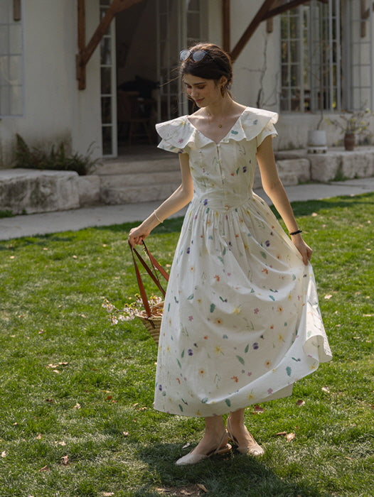 Young woman twirling in a vintage-style floral dress with flutter sleeves, carrying a straw basket as she enjoys a serene afternoon in a garden setting.
