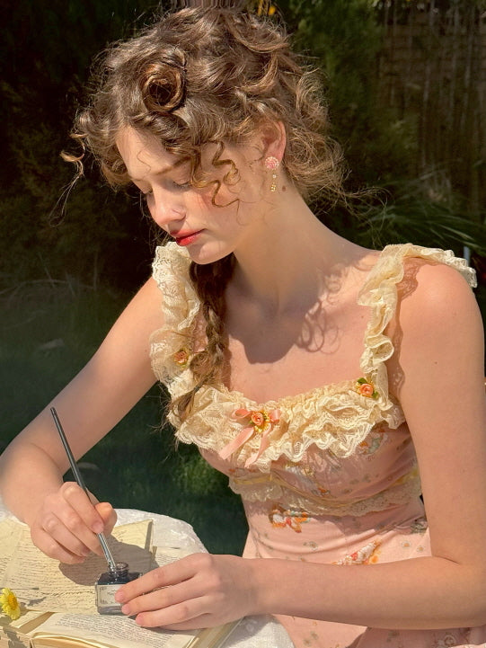 Close-up of a young woman writing with ink in a vintage notebook, wearing a romantic lace-trimmed floral dress adorned with ruffles and bow accents.