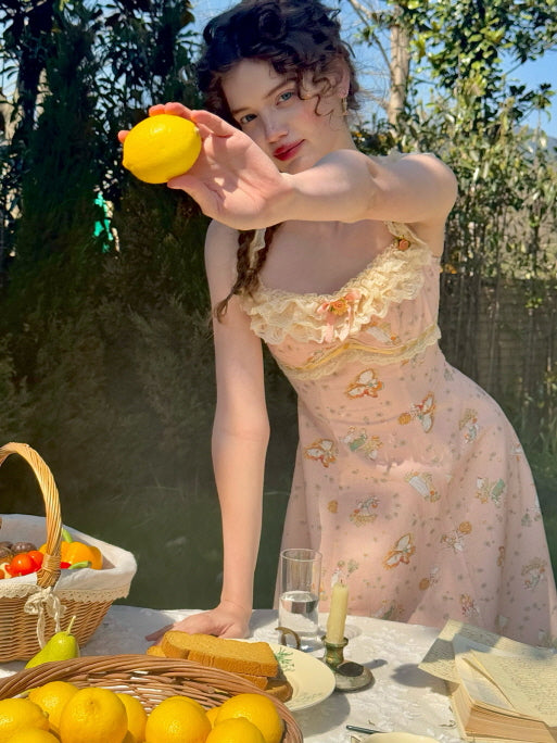 Whimsical scene of a young woman in a floral cottagecore dress holding a lemon, surrounded by a rustic picnic setting with fruits and vintage tableware.