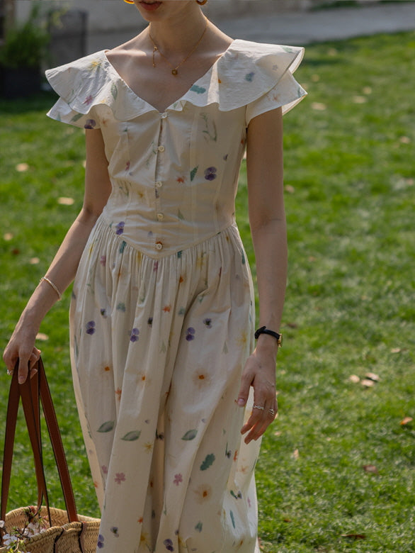 Close-up of a cottagecore floral dress with ruffled sleeves and delicate button details, as the woman carries a woven basket, evoking a soft, vintage-inspired style.