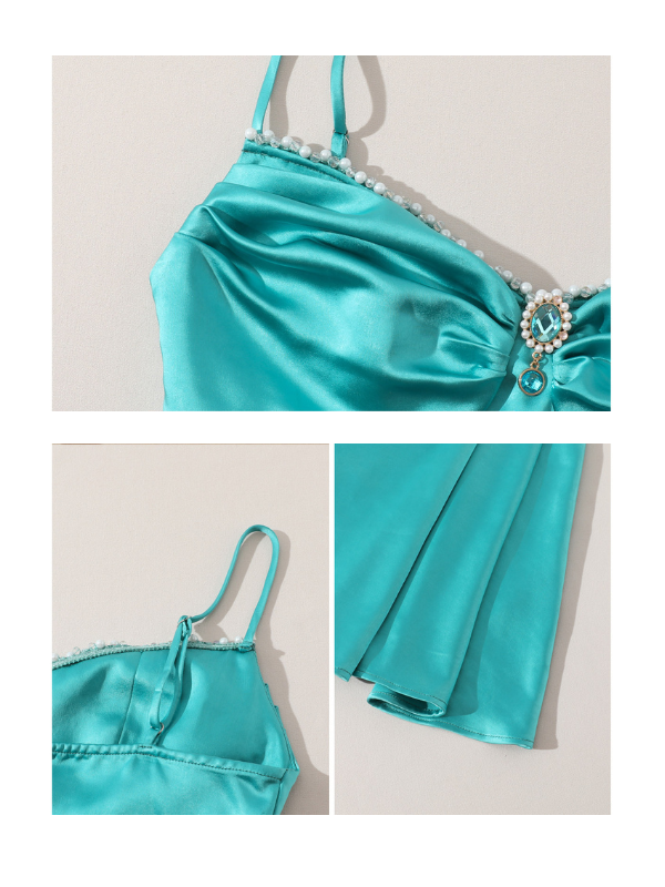 Close-up details of a turquoise satin dress, featuring a pearl-accented neckline, jewel embellishment, and adjustable spaghetti straps — luxurious evening dress, fairytale-inspired fashion, delicate fabric texture.
