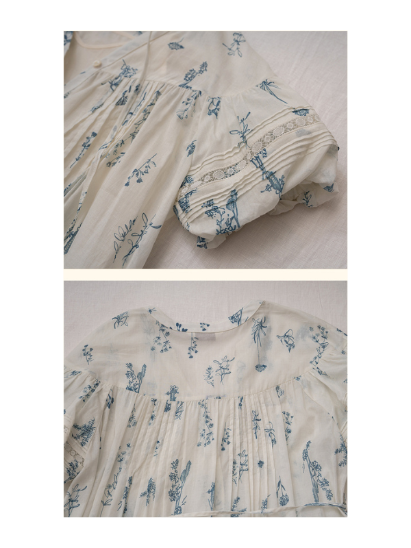 Sleeve detail of the vintage floral dress, showcasing lace trim and gentle pleating, adding a romantic touch to the design.