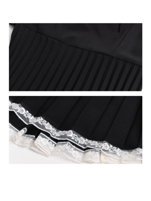 Detail view of the pleated skirt and lace-trimmed hem of a retro black dress, showcasing its elegant texture and fairytale-inspired finish.