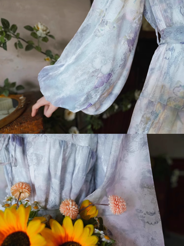 Close-up of the lavender floral dress showcasing its delicate puff sleeves with soft butterfly patterns and subtle shimmer, styled with a bouquet of sunflowers for a whimsical fairycore look.