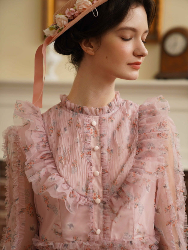 Close-up of a model in a soft pink floral ruffle dress with her eyes closed, radiating vintage elegance and coquette charm.