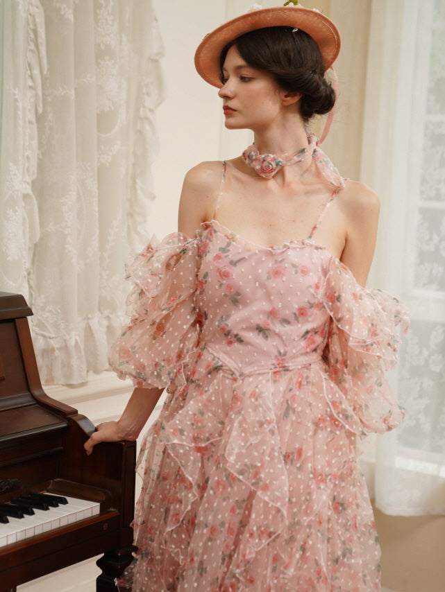 Close-up side view of a woman in a romantic pink ruffle dress with rose details, gazing softly by the piano in a fairytale-inspired outfit.