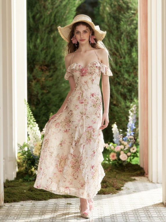 A young woman walks confidently in a flowing floral dress with ruffle layers, framed by garden blooms that enhance the fairytale atmosphere.