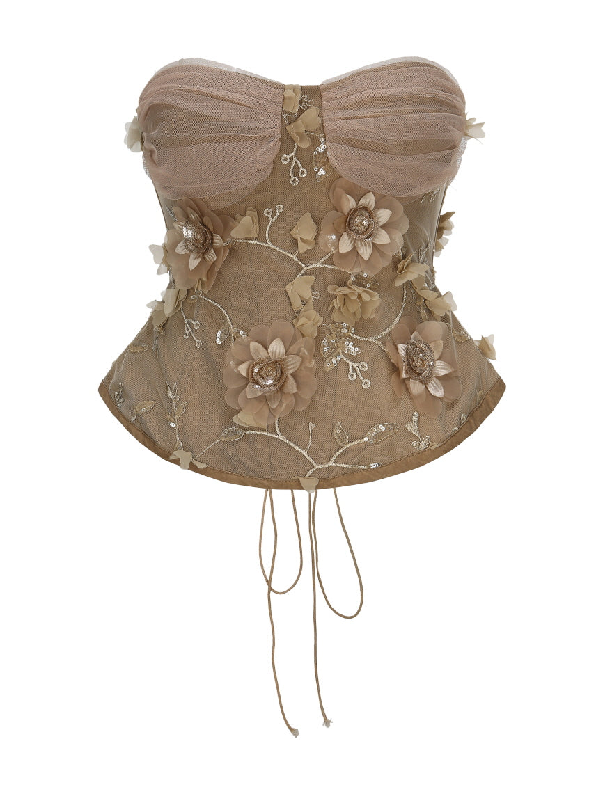 A strapless nude corset top with 3D floral embroidery and sequin details, designed for an elegant fairycore or coquette aesthetic look.