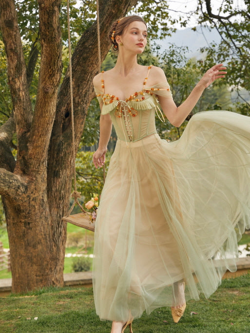A woman twirls in a pastel green princesscore dress with floral details, the layered tulle skirt flowing in a fairytale-inspired garden setting.