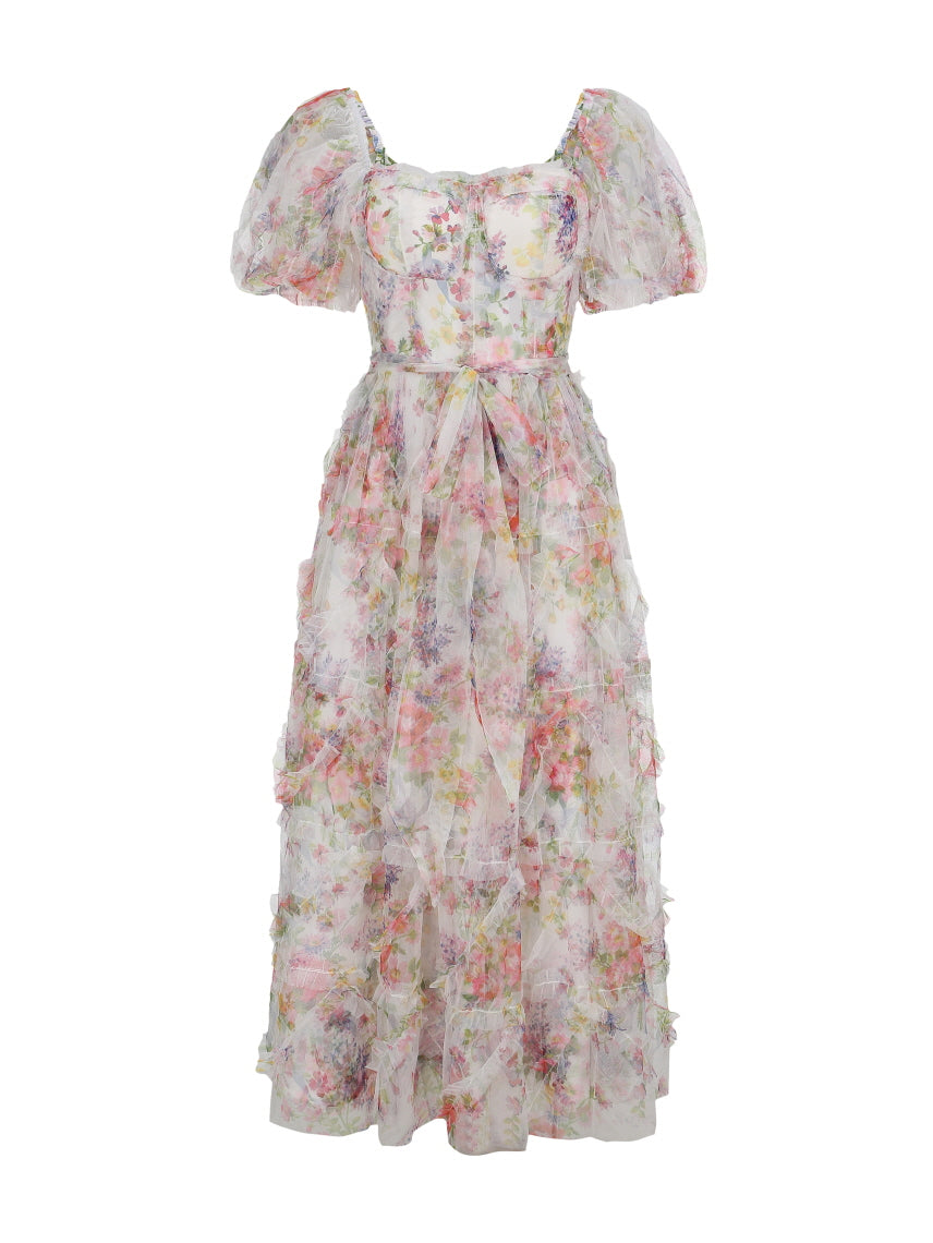 Flat lay of a vintage-inspired floral puff sleeve dress with a sweetheart neckline and layered ruffle skirt, perfect for a cottagecore wardrobe.