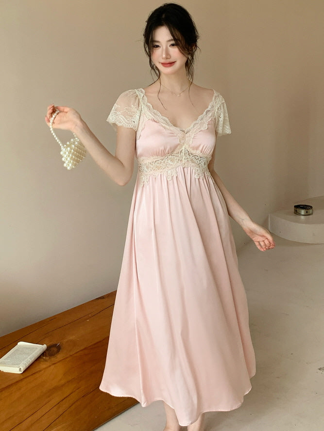 Model in a princesscore pink lace nightdress poses gracefully with a pearl bag in hand, exuding a dreamy and elegant fairytale charm.
