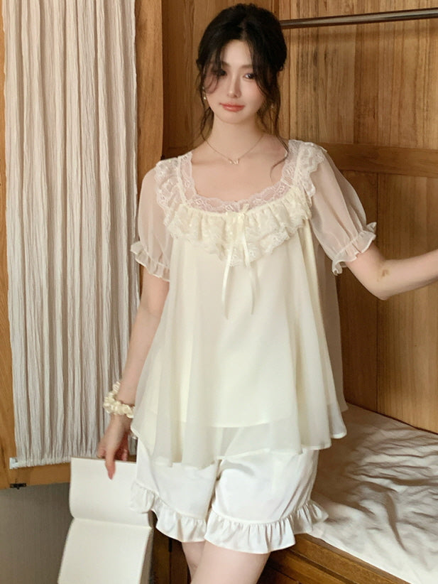 Model in soft lighting wearing a frill-trimmed coquette loungewear set with sheer sleeves and a romantic lace collar, evoking a princesscore aesthetic.