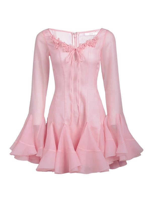 A pastel pink mini dress with flared sleeves and floral neckline detailing, perfect for romantic princesscore and coquette-inspired outfits.
