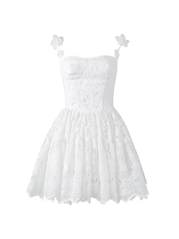 A white lace mini dress with floral embroidery and 3D flower straps, capturing a romantic silhouette perfect for fairycore and princesscore styling.