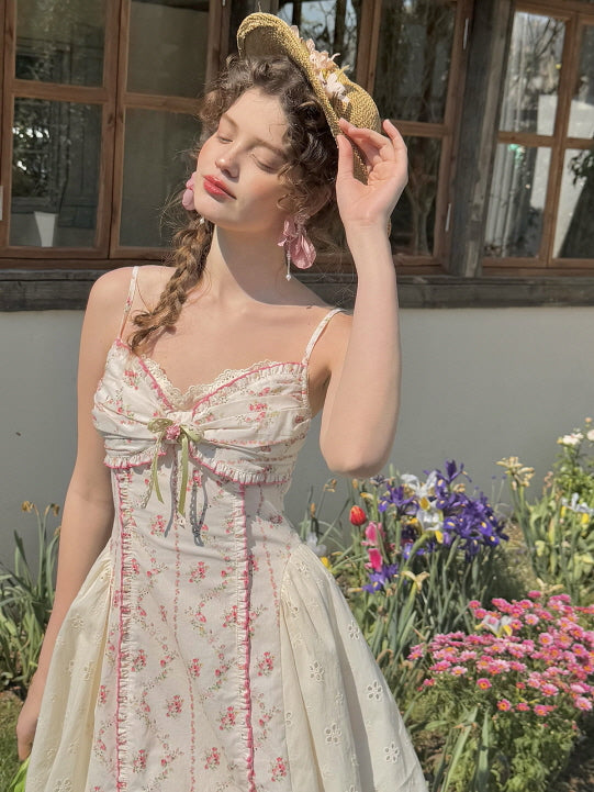 Coquette floral dress with lace trim, ruched bodice, and bow detail in a romantic vintage-inspired design. Perfect for dreamy summer outfits and feminine, flirtatious aesthetics.