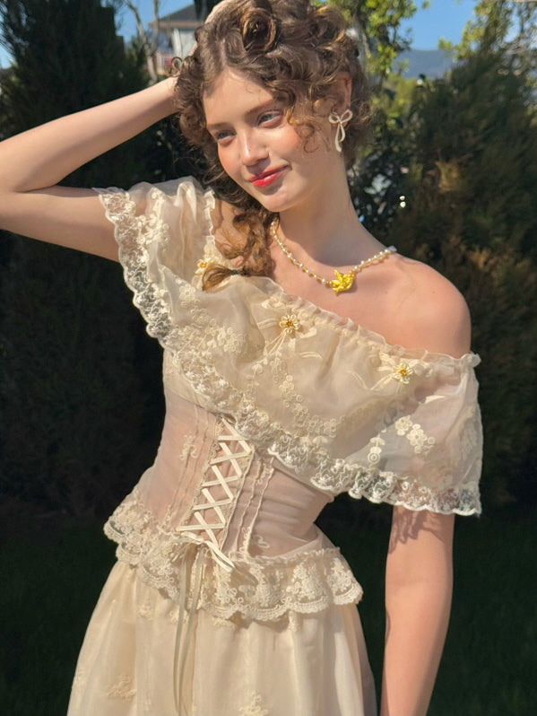Close-up of romantic off-shoulder lace corset dress with yellow flower appliqués, worn in a spring garden with vintage hairstyle and butterfly necklace – elegant feminine aesthetic