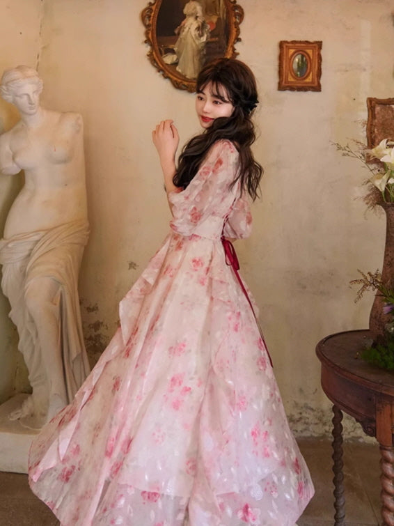 A dreamy, fairytale-inspired floral dress with cascading ruffles and delicate pink rose patterns, creating a romantic princesscore aesthetic.