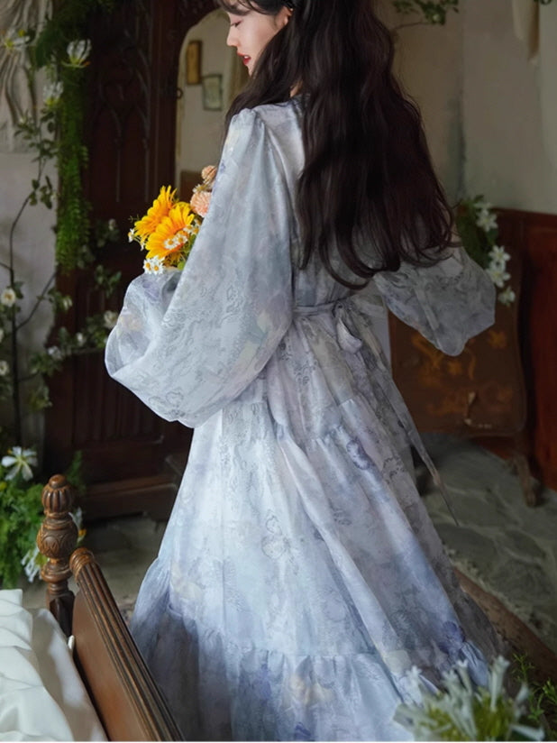 Back view of a lavender floral dress with a tied waist and flowing tiered skirt, styled with a bouquet of sunflowers for a dreamy fairycore look.