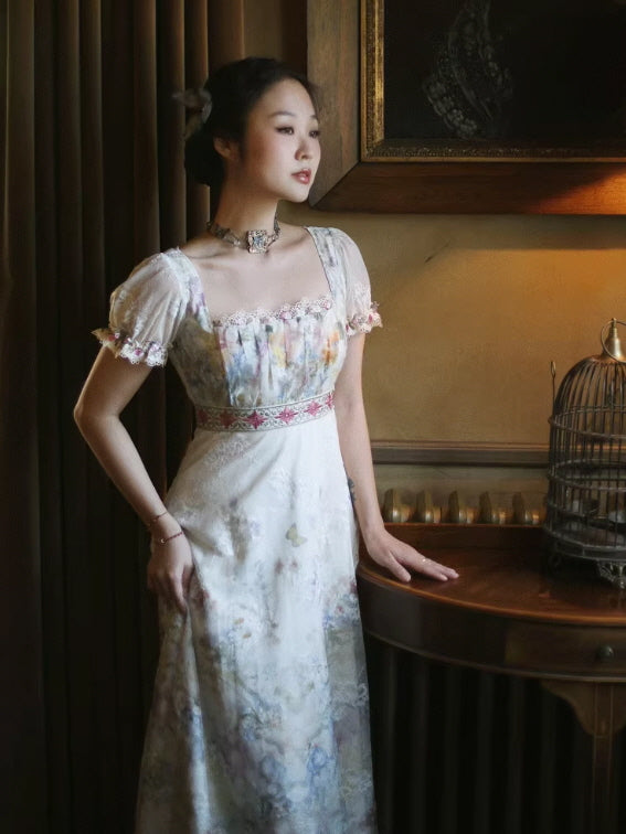 Model wearing a Romantic Fairytale vintage floral lace maxi dress with a square neckline, puff sleeves, and an embroidered empire waist, styled in a romantic cottagecore princesscore room