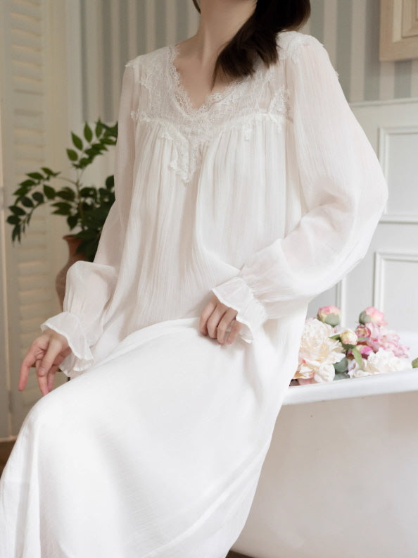 Close-up of ivory V-neck nightgown with lace yoke detail, airy sheer sleeves and soft gathered bodice, vintage cottagecore princesscore loungewear style.