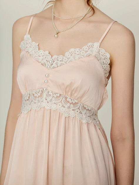 Close-up of blush pink lace nightgown bodice with scalloped white lace trim and pearl buttons, romantic princesscore loungewear from Romantic Fairytale.