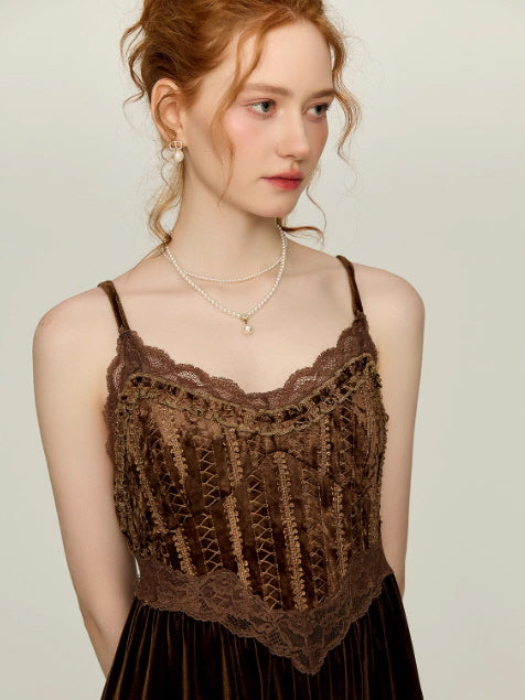 Close-up of a chocolate brown lace corset-style nightgown bodice with delicate scalloped trim and ribbon details, styled in a vintage princess aesthetic.