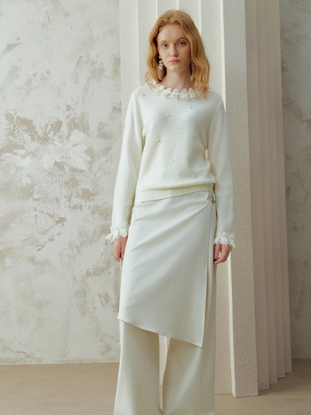 Romantic white pearl detail knit top with lace-trimmed neckline and cuffs, styled with a soft wrap skirt for a vintage cottagecore aesthetic outfit.