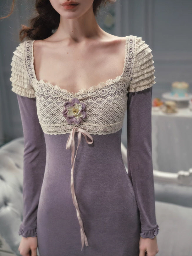Close-up of a lavender vintage-inspired dress with an intricate lace bodice, square neckline, floral appliqué accent, ribbon tie detail, and long sleeves, styled in a romantic fairycore aesthetic outfit.