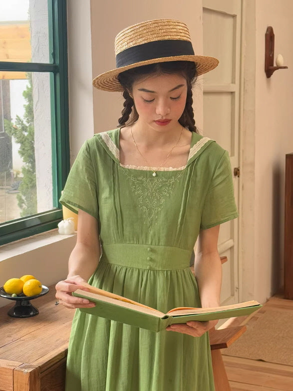 Side profile of a romantic fairytale dress with embroidery, featuring a straw hat and braids in a lush, plant-filled fairycore interior.
