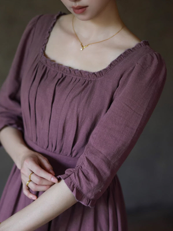Close up detail of romantic vintage dress with gathered neckline and soft cotton fabric in dusty rose color, elegant cottagecore prairie style garment