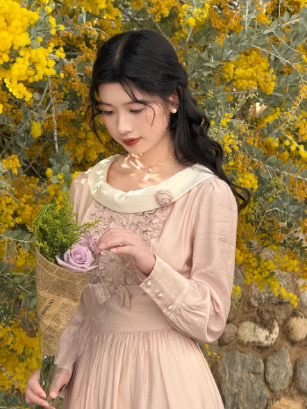 Elegant fairycore vintage dress with long sleeves and ruched bodice, soft pink romantic outfit styled with rose bouquet