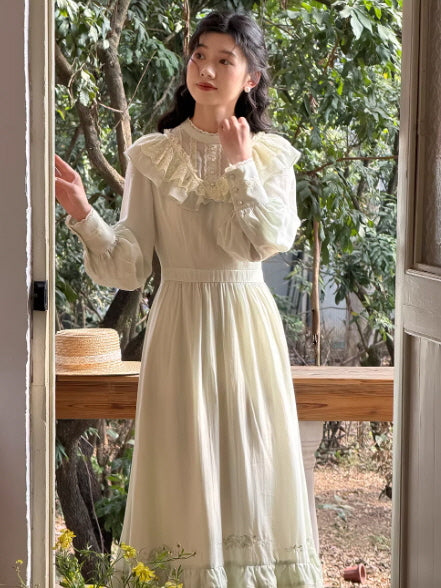 Elegant fairycore prairie maxi dress in soft sage green with lace neckline and flowing skirt, vintage countryside aesthetic