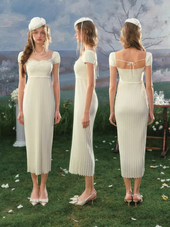 Ivory embroidered dress front side and back view, slim silhouette with pleated texture and delicate ribbon tie detail