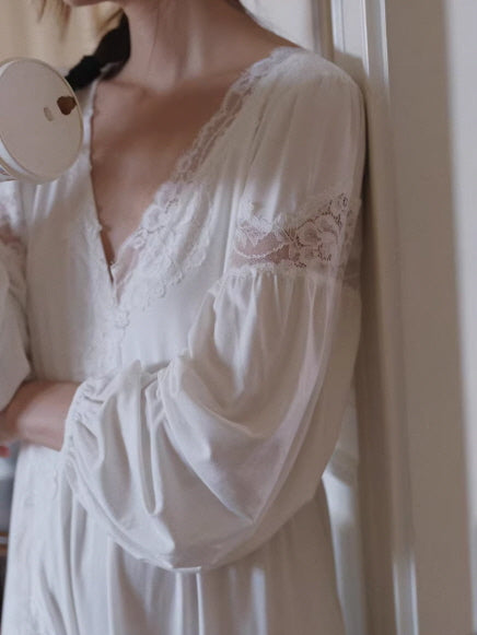 Close-up of lace neckline and sheer sleeve detail on white romantic nightgown, feminine and soft texture focus