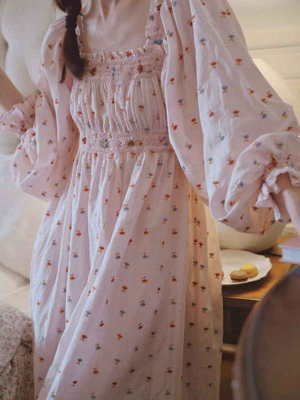 Light pink floral long dress with smocked bodice and romantic fit, dreamy vintage home aesthetic and soft feminine style