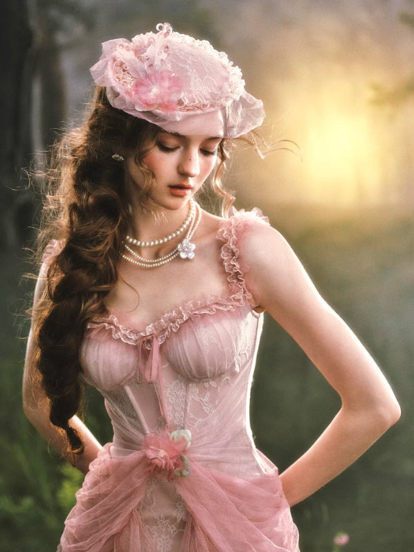 Soft vintage pink lace dress with floral bonnet and pearl accessories, featuring delicate ruffle neckline and feminine fairycore styling