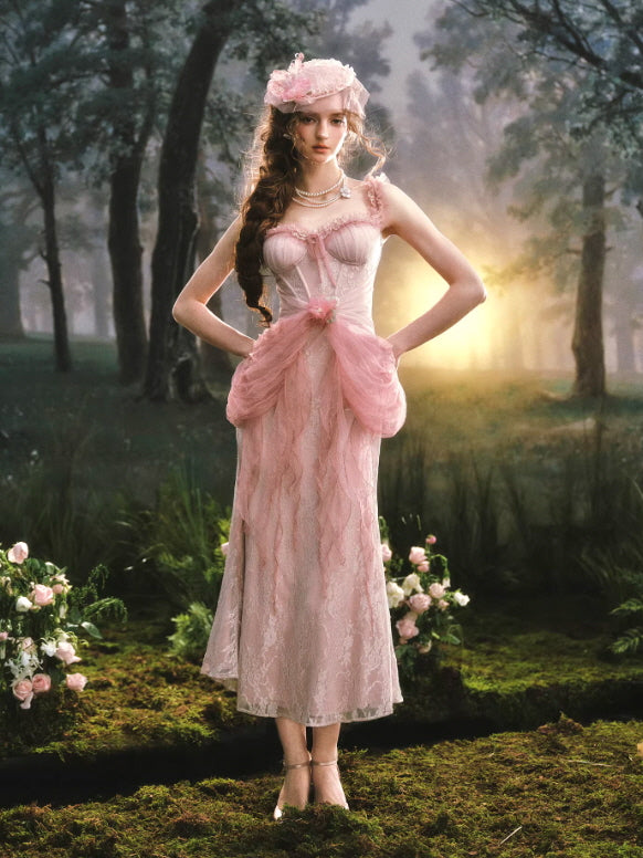 Vintage inspired pink lace midi dress with sheer tulle draping and fitted corset bodice, styled in dreamy forest cottagecore setting