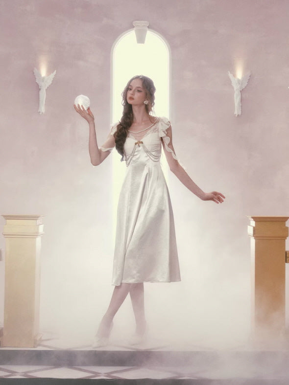 Ivory satin fairy dress full length, romantic princess style with pearl embellishments and ethereal soft lighting background