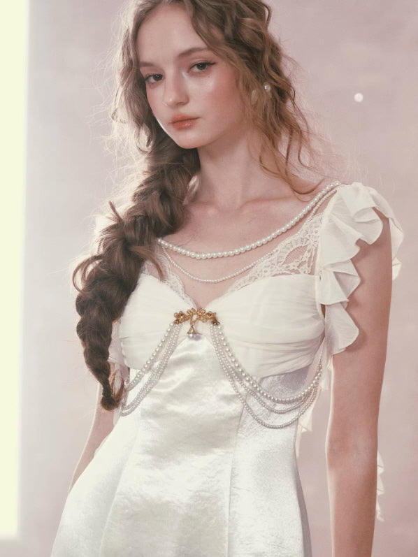 Romantic ivory satin dress with lace detail and pearl draping, soft feminine fairycore aesthetic close-up portrait